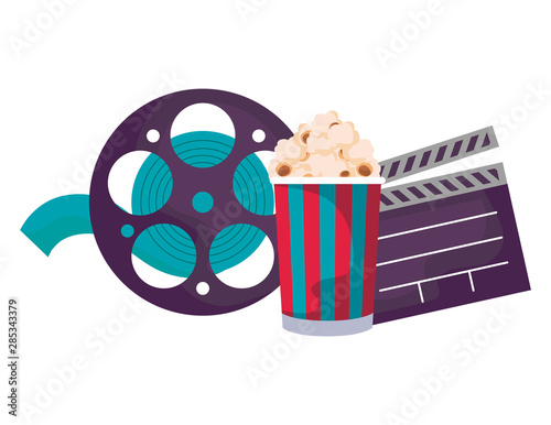 clapboard cinema with tape and popcorn