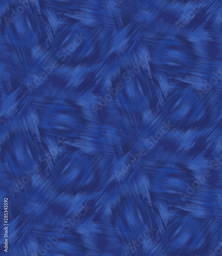 Indigo blue woven shibori tie dye. Seamless pattern background. Japanese style batik textile. Variegated denim navy for summer fashion swatch.