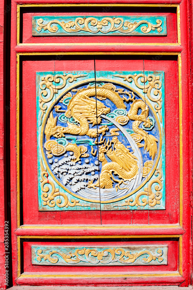 Traditional chinese dragons pattern in an ancient palace. Located in Shenyang, Liaoning, China.