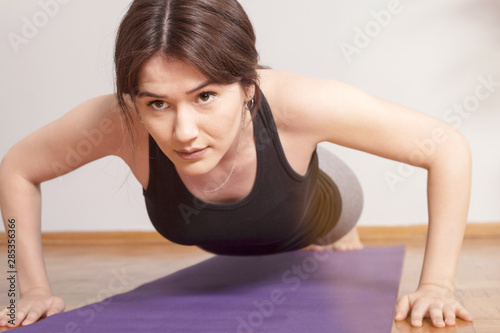 young woman doing fitnes exercise