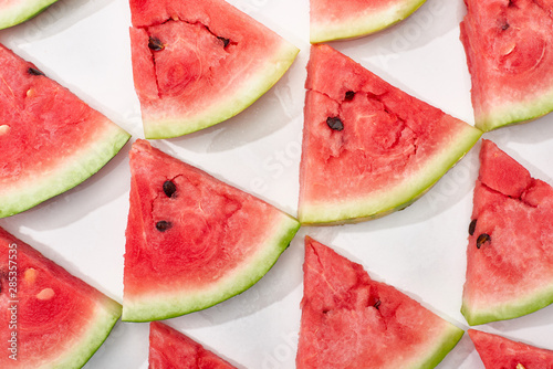flat lay with delicious watermelon slices on white background
