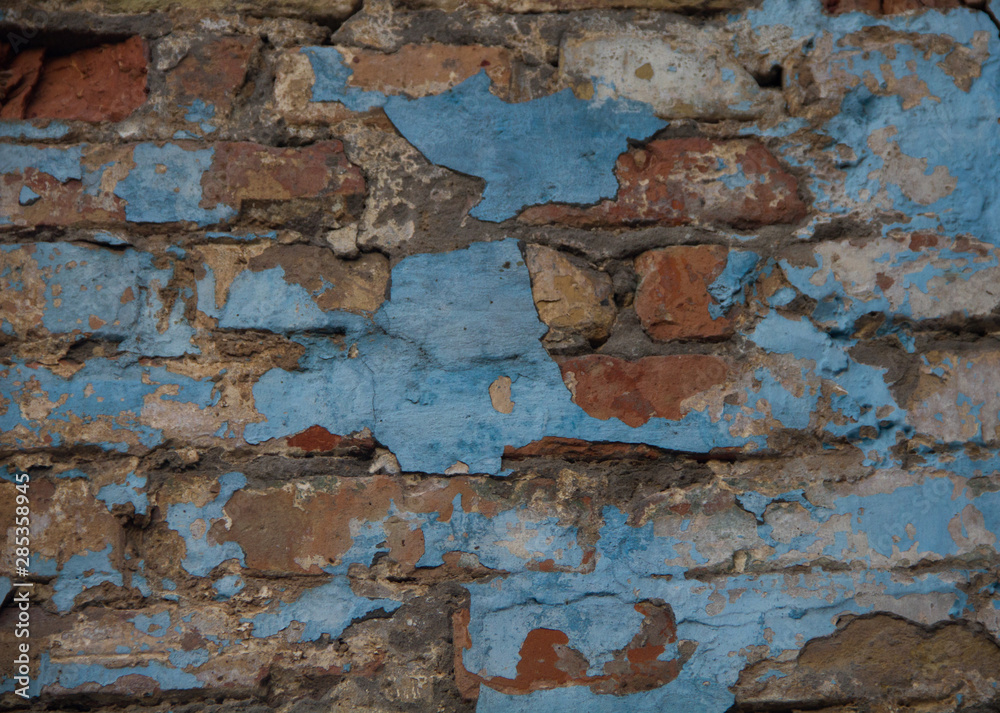 old wall. brick wall with peeling blue paint. Background old wall. brick wall with peeling blue paint. Background
