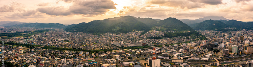 Aerial drone photo - Sunset over Nagano City.  Nagano Prefecture, Japan.  Asia