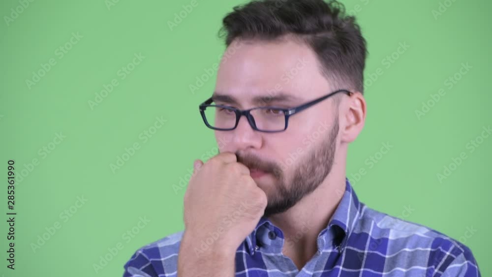 Face of funny young bearded hipster man talking and being interrupted Face of funny young bearded hipster man talking and being interrupted
