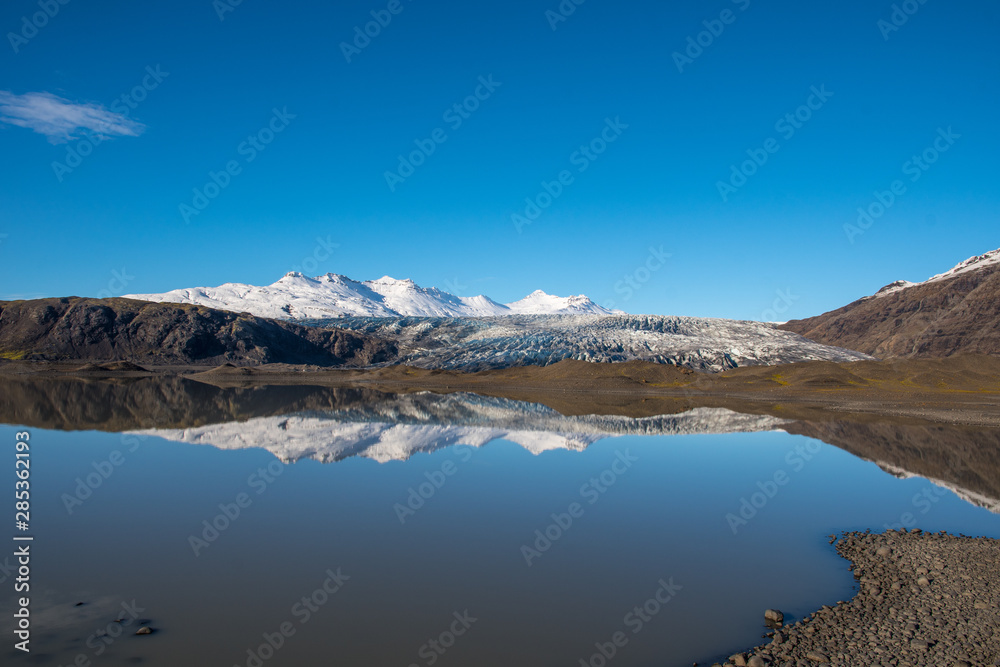 River Holmsa, Glacier Flaajokull and mountain and Flafjall mountain on a summer day in south Iceland