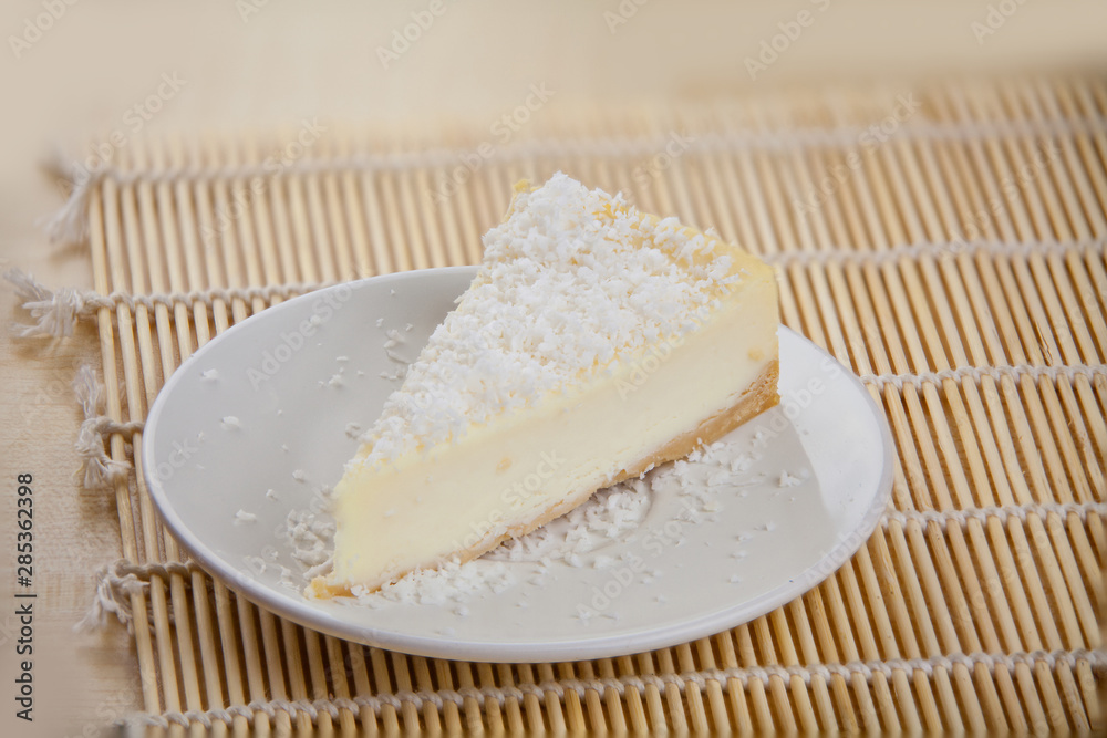 delicious cheesecake with coconut on  plate