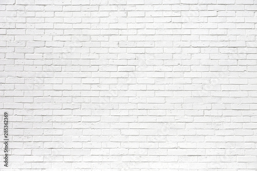 white brick wall may used as background photo