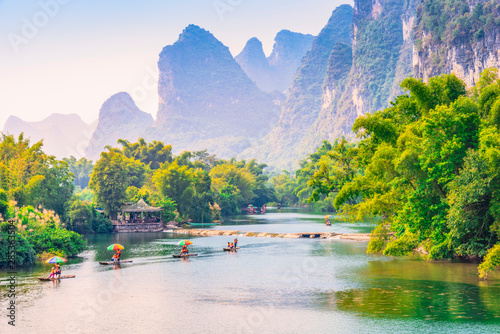 Landscape of Guilin. Tourists are visiting by Bamboo raft. Located in Yangshuo, Guilin, Guangxi, China.