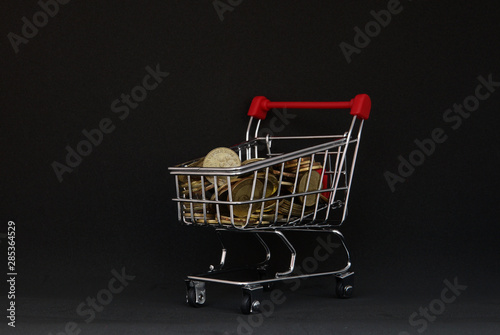 supermarket empty shopping trolley cart and black background 