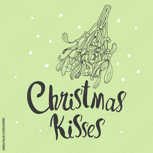 Vector holiday illustration Christmas Kisses on green background with branch of mistletoe. Handwritten inscription. Lettering design. Sketch style. photo