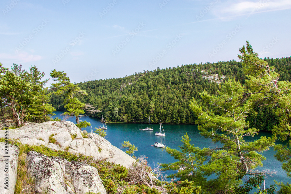 Fototapeta premium boats at anchor in Covered Portage, Killarney, Ontario, Canada