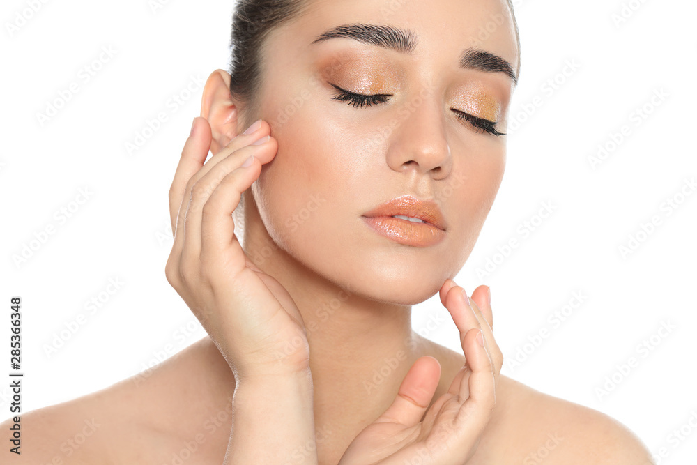 Beautiful young woman with glitter makeup on white background Beautiful young woman with glitter makeup on white background