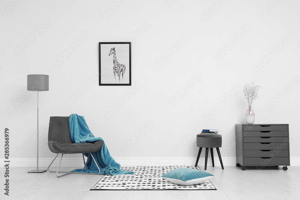 Room interior with stylish furniture near white wall Room interior with stylish furniture near white wall