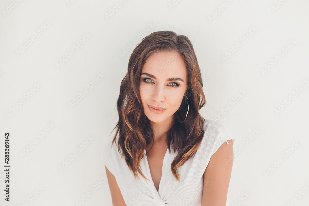 emotional portrait of Fashion stylish portrait of pretty young hipster blonde woman,going crazy,elegant black hat,soft colors,cool crazy  girl.Red urban wall background.surprised girl close up, sunset