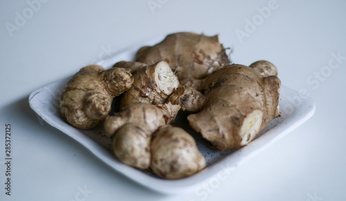 Ginger or Zingiber officinale on white background. Used as a spice and a folk medicine.