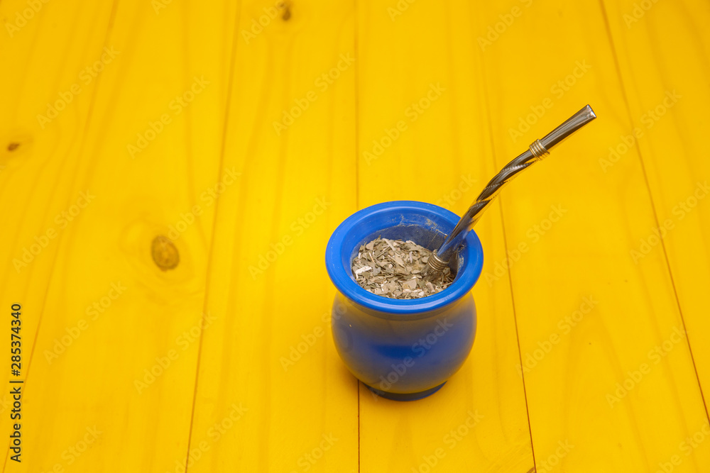 matte, thermos and hands on wooden background matte, thermos and hands on wooden background
