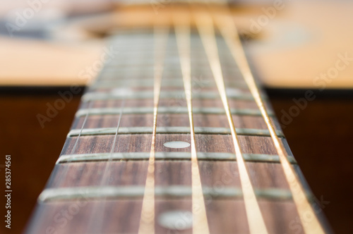 Fingerboard and Inlay of Wood Acoustic Guitar in Zoom View