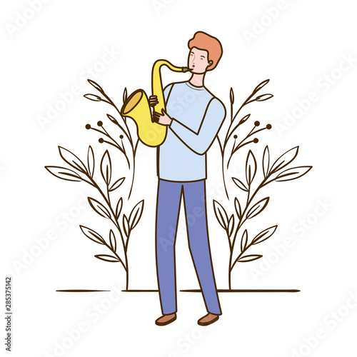 man with saxophone and branches and leaves in the background