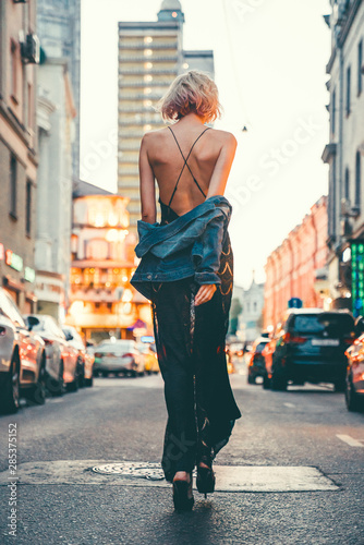 Canvas Print Beauty woman posing with red car in the street,fashion model,outdoor crazy portr