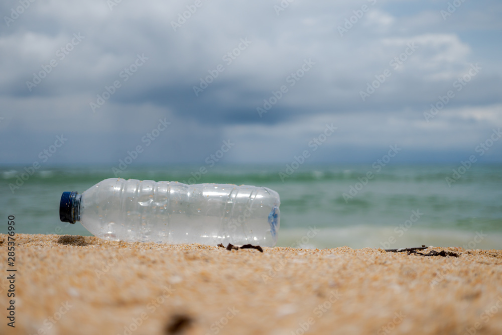 plastic bottle on the beach pollution and environment conceptual plastic bottle on the beach pollution and environment conceptual