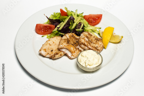grilled squid with tartar sauce and vegetables
