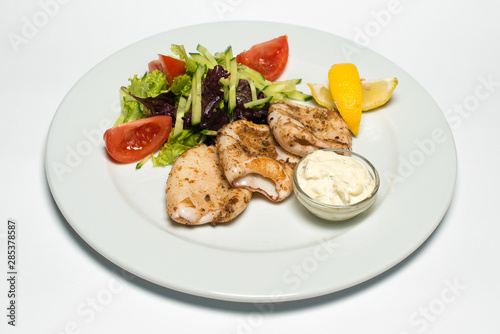 grilled squid with tartar sauce and vegetables