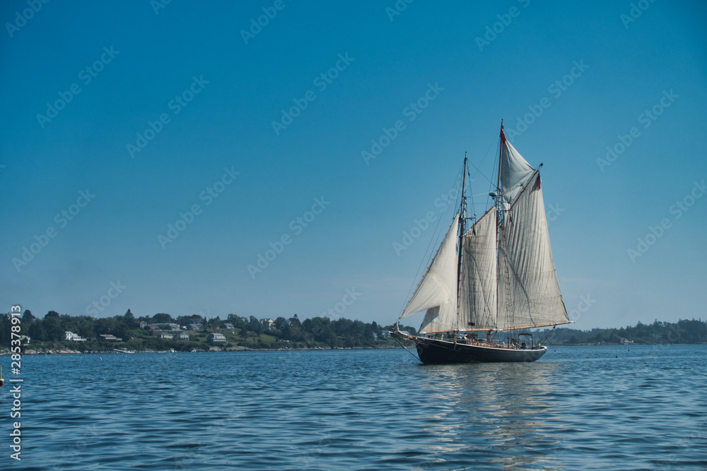 Outside nature photo featuring ocean boat and blue sky