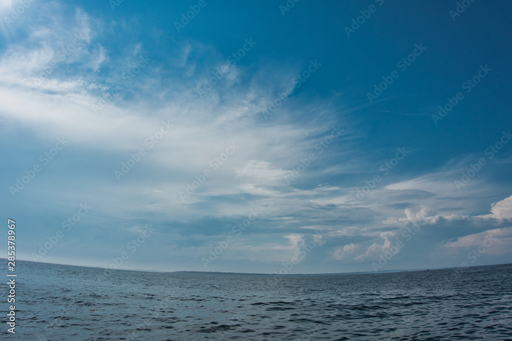 Outside nature photo featuring - clouds and ocean