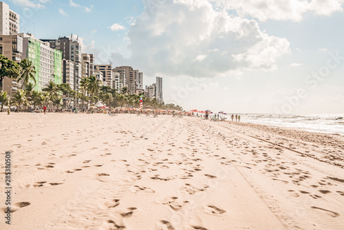 Recife, Boa Viagem Beach, Pernambuco, Brazil - June, 2019: Blue sky day at the beach early in the morning.