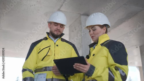 Architect or engineer working, browsing building project indoor of construction site with blueprint plan. businessman worker, man male construction engineers or architects working people. Two Engineer