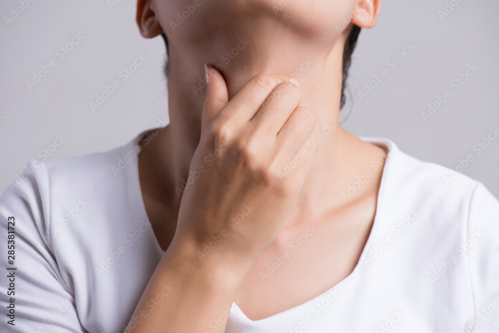 Sore Throat. Closeup Of Beautiful Young Woman Hand Touching Her Ill Neck. Healthcare and medical concept. Sore Throat. Closeup Of Beautiful Young Woman Hand Touching Her Ill Neck. Healthcare and medical concept.