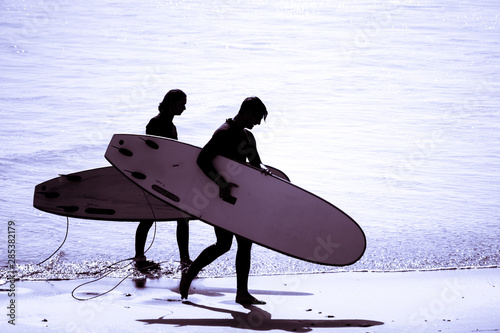 Surfing silhouette surfer man wearing wetsuit surf in tamraght taghazout agadir morocco 