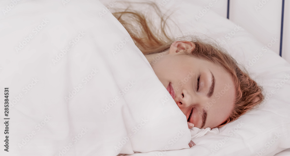 Sleepy woman lying in bedding and dreaming. Night resting or morning wake up. Sleepy woman lying in bedding and dreaming. Night resting or morning wake up.