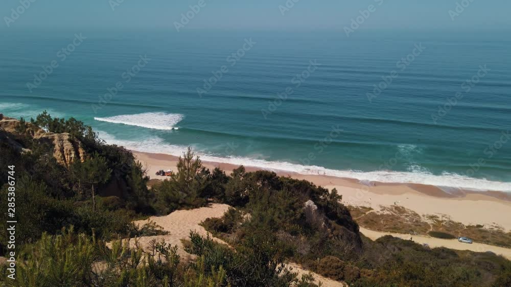 Beach coast aerial shot from the cliff. Panoramic slow motion shot. Beach coast aerial shot from the cliff. Panoramic slow motion shot.