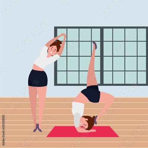 beauty girls couple practicing pilates position in the gym