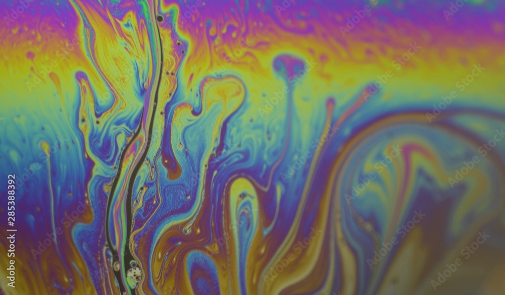 Soap bubbles macro motion. Rainbow colors. Moving surface of colorful bubble patterns