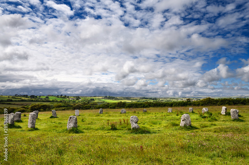 Merry Maidens of Boleigh neolithic stone circle with 19 standing stones on a mound in Cornwall England