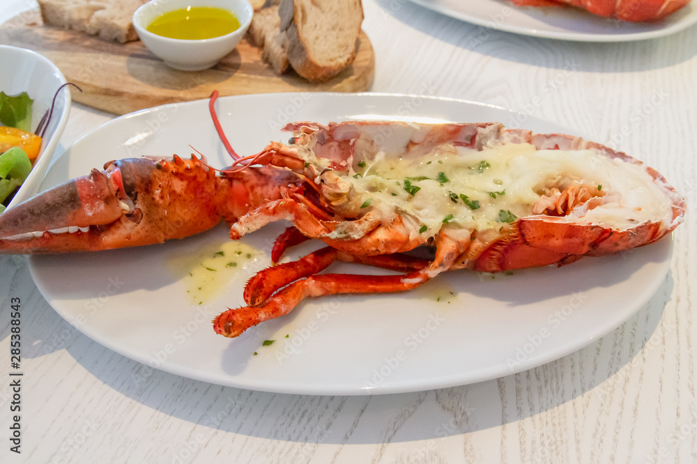 Grilled cheese lobster with Seasoning with spices on the table as a luxury meal Grilled cheese lobster with Seasoning with spices on the table as a luxury meal