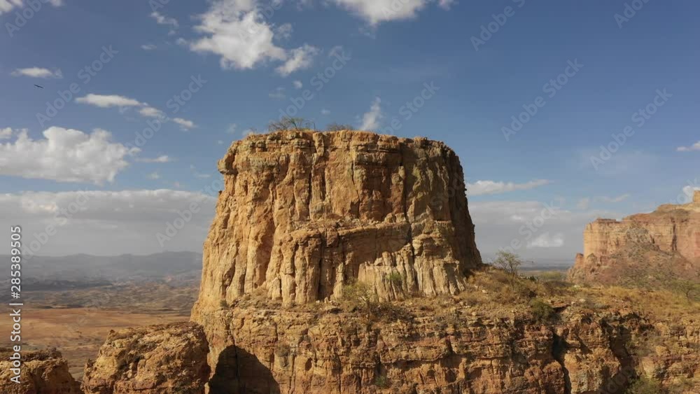 Aerial view of steep mountain cliff and desert landscape in Ethiopia