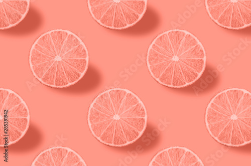 Vivid fruit pattern of fresh citrius on colourful background photo