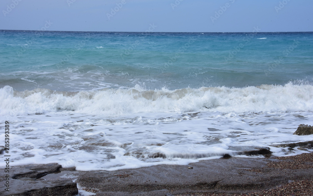 The rough waters of the Mediterranean Sea off the east coast of the Greek island of Rhodes.