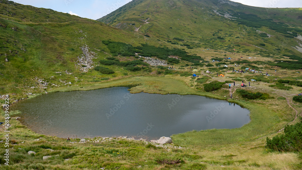 Lake in the Carpathians in the summer sunny day