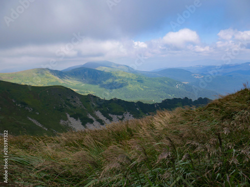 Mountain valley during sunrise / sunset. Natural summer landscape. Colorful summer landscape in the Carpathian mountains.