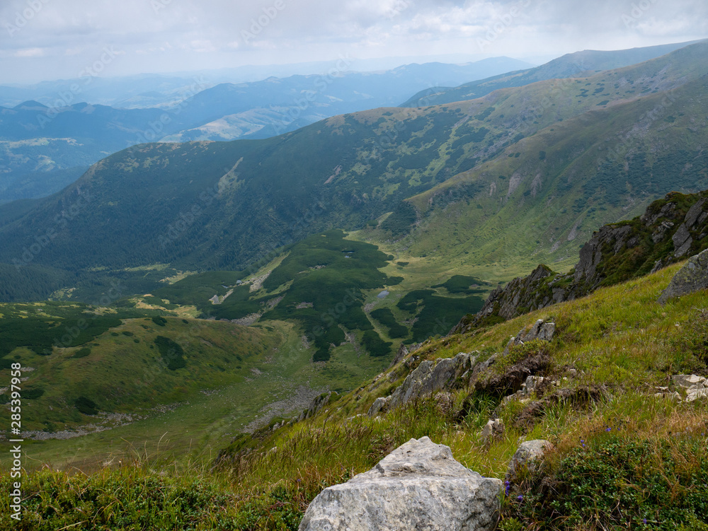 Mountain valley during sunrise / sunset. Natural summer landscape. Colorful summer landscape in the Carpathian mountains. Mountain valley during sunrise / sunset. Natural summer landscape. Colorful summer landscape in the Carpathian mountains.
