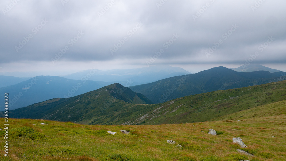 Mountain valley during sunrise / sunset. Natural summer landscape. Colorful summer landscape in the Carpathian mountains.