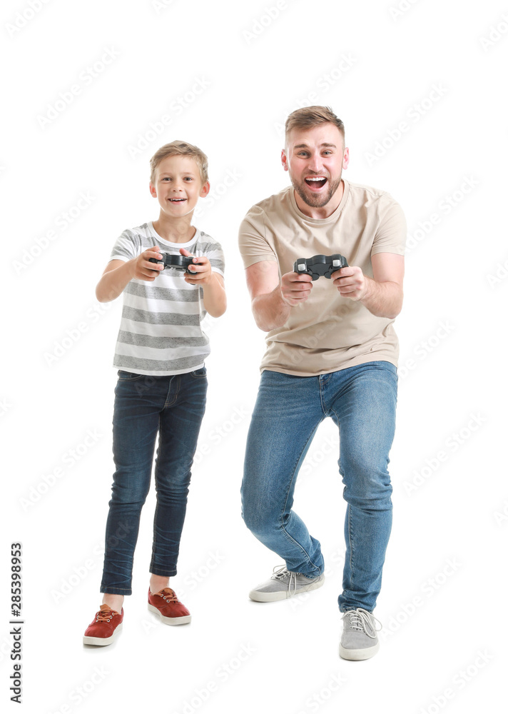 Fototapeta premium Portrait of father and son playing video game on white background