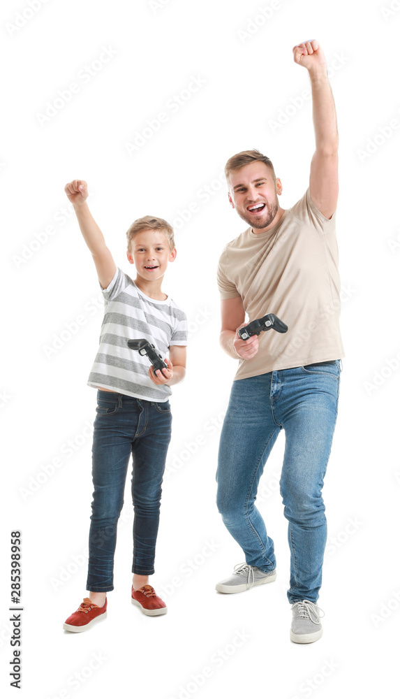 Portrait of father and son playing video game on white background Portrait of father and son playing video game on white background