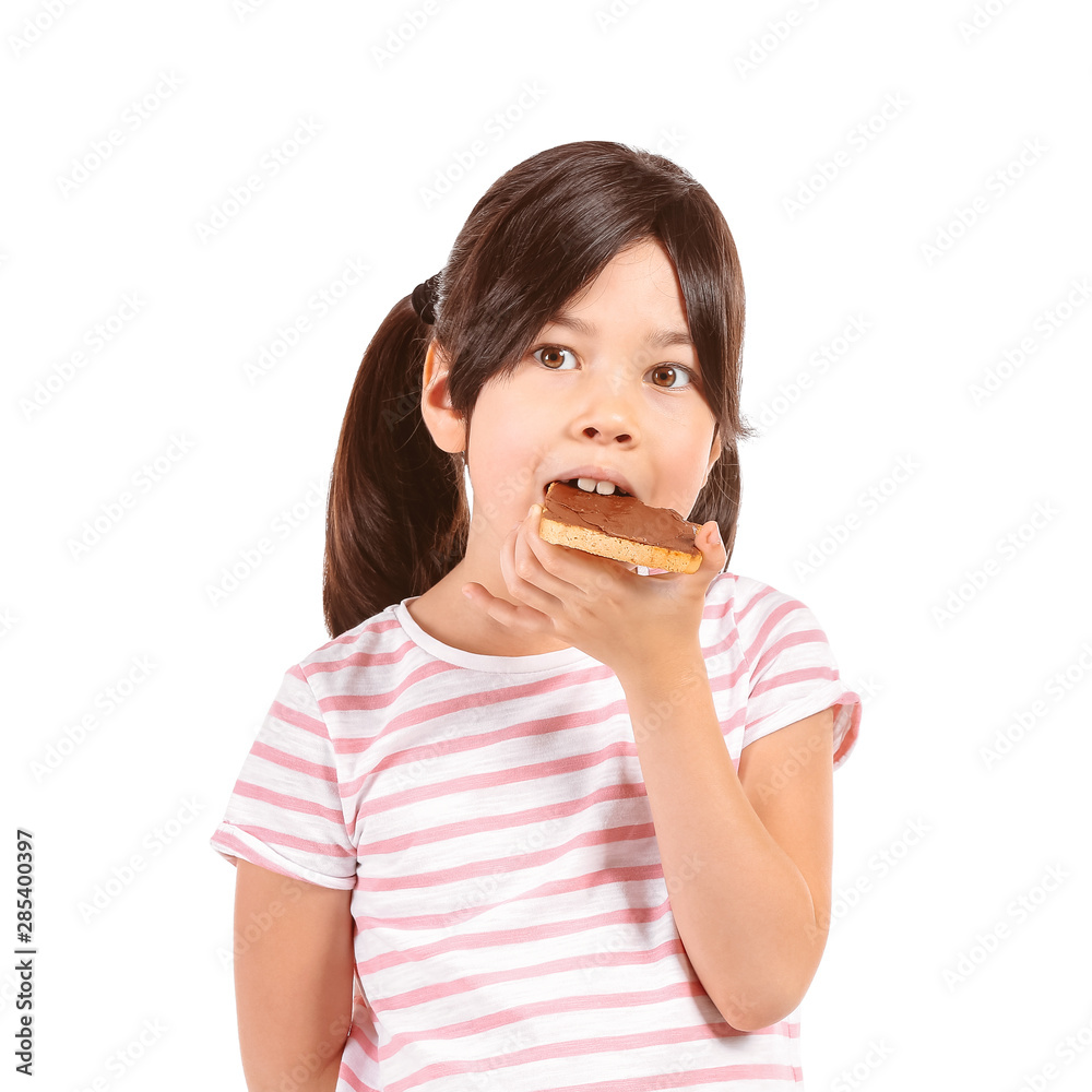 Funny little girl eating tasty toast on white background Funny little girl eating tasty toast on white background