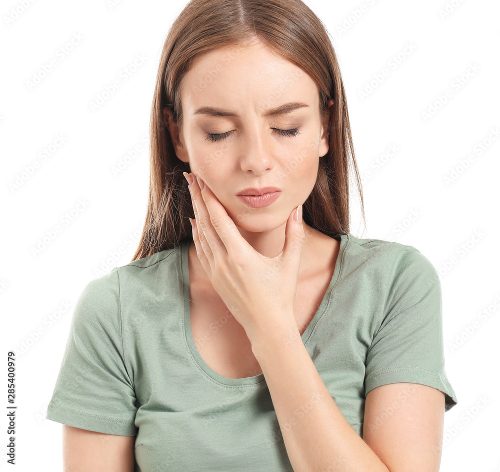Young woman suffering from toothache against white background Young woman suffering from toothache against white background