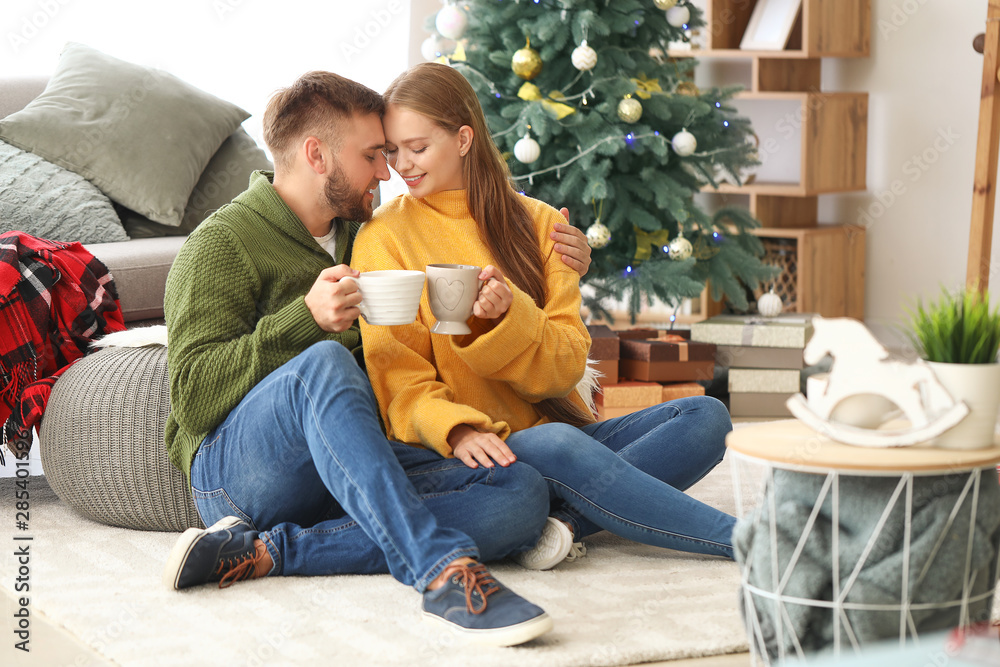 Young couple drinking hot chocolate at home Young couple drinking hot chocolate at home
